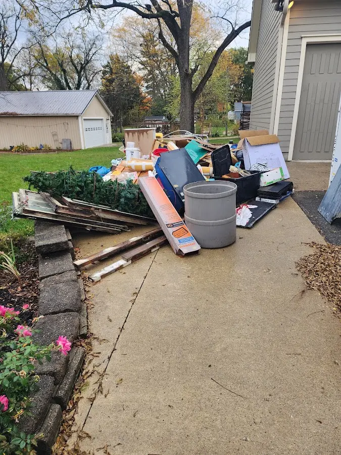 Dumpster being loaded with debris for 12 Yard Dumpster Rental in Wildomar